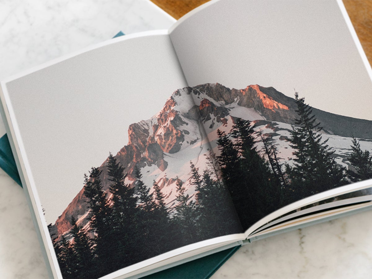 Hardcover Photo Book opened to picture of mountainscape